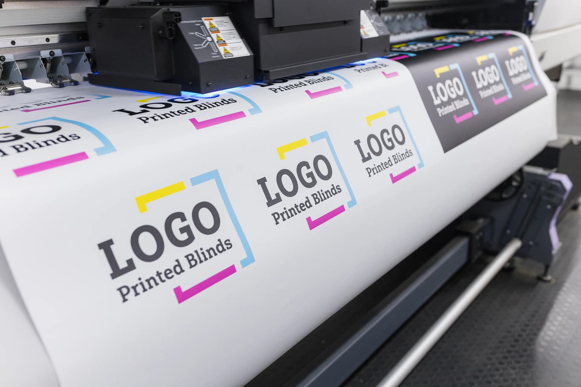 Commercial printing press producing logo printed blinds for UK business customers